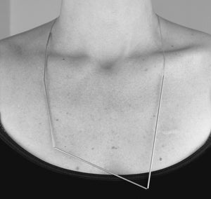 Beautiful, architectural jewelry. Brass and silk.