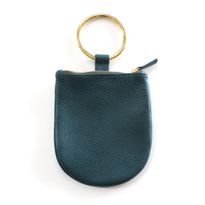 Minaudière Wristlet Handbag. Best replacement for classic clutch. Soft leather pouch with brass ring that slips easily on the wrist. Sized to hold your phone and necessities. Unlined.