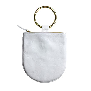Minaudière Wristlet Handbag. Best replacement for classic clutch. Soft leather pouch with brass ring that slips easily on the wrist. Sized to hold your phone and necessities. Unlined.